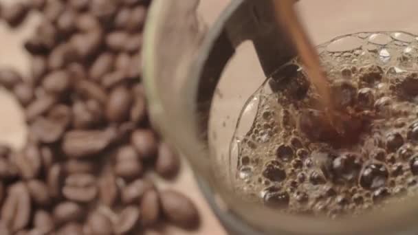 Pouring Fresh Coffee Pot Coffee Beans Background — Vídeo de Stock