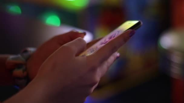 Young Teenage Girl Holds Her Phone Arcade Types Text She — Vídeos de Stock