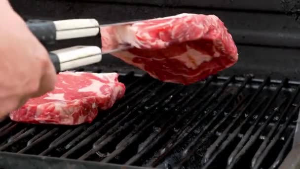 Two Raw Rib Eye Steaks Cooking Grill One Gets Set — Video