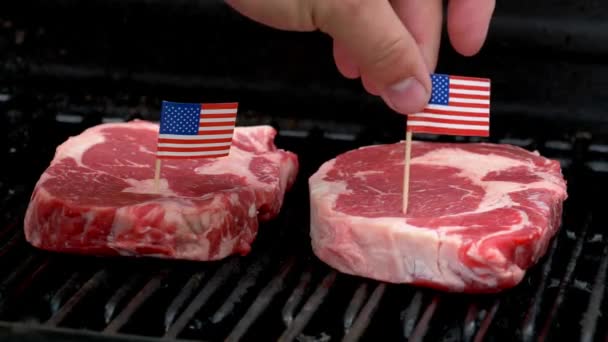 Two Juicy Rib Eye Steaks Sitting Grill Cooking Hand Comes — Vídeo de Stock