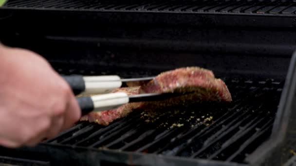 Two Raw Rib Eye Steaks Cooking Grill One Gets Flipped — Video