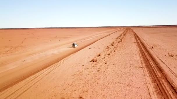 Drone Car Large Dust Trail Travels Desolate Open Flat Dirt — Stock videók