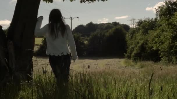 Woman Leaning Tree Landscape Farmers Field — Video