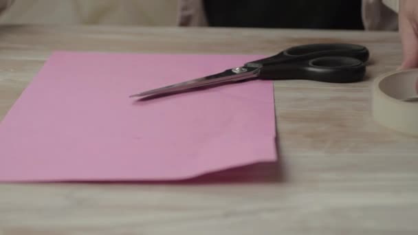 Woman Wrapping Gift Pink Paper — Video Stock