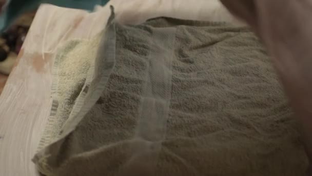 Woman Folding Towels Doing Laundry — стоковое видео