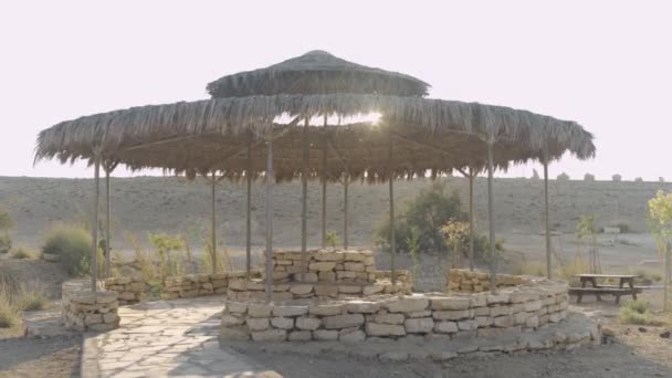 Rest Area Desert Sun Canopy Stone Structure Wide Shot — Stockvideo