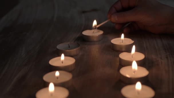 Lighting Row Candles Matches — Stock Video
