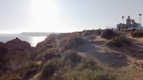 Ponta Piedade Lighthouse Distant Cliffs Silhouetted Sunlight Portugal — Stockvideo