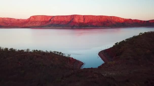 Straight Fast Tracking Aerial Shot Dramatic Red Cliff Sunset Far — Stockvideo