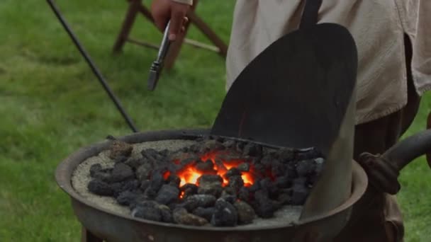 Revolutionary War Reinacter Blacksmith Puts Piece Metal Hot Coals Heat — Stock Video