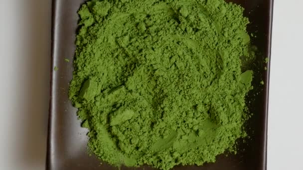 Match Green Tea Powder Brown Stone Plate Rotating Center Frame — 图库视频影像