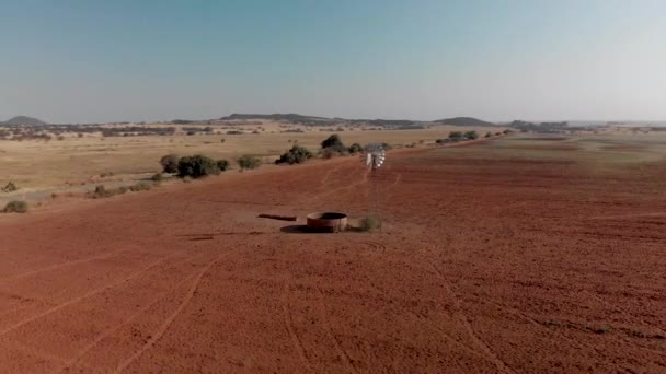Aerial Close Rotating Shot Working Windpump Dry Field — ストック動画