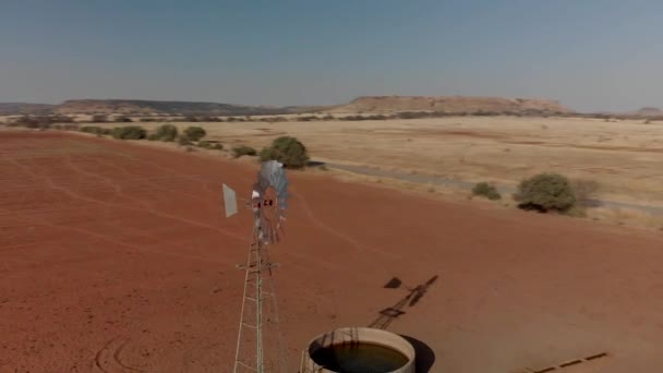 Aerial Close Rotating Shot Working Windpump Dry Field — Video Stock