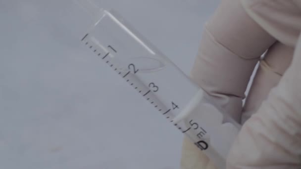 Hand Wearing Medical Gloves Holding Plastic Medical Syringe Macro — Stock video