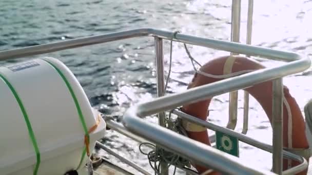 Close Boat Rail Life Saver Ring Float While Boat Sails — Vídeos de Stock