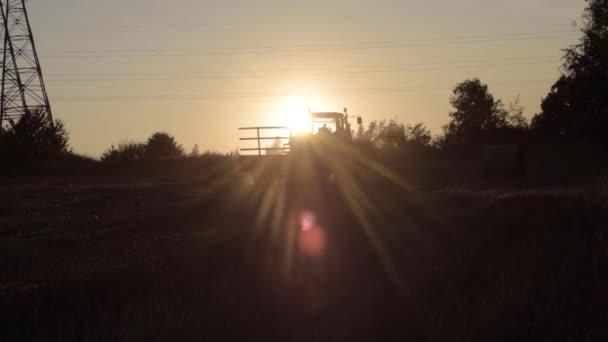 Silhouette Farmer Climbing Stationary Tractor Sunset — Αρχείο Βίντεο