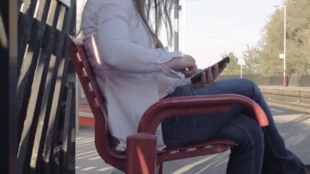 Woman Using Mobile Phone While Waiting Train Railway Station Platform — Vídeo de Stock