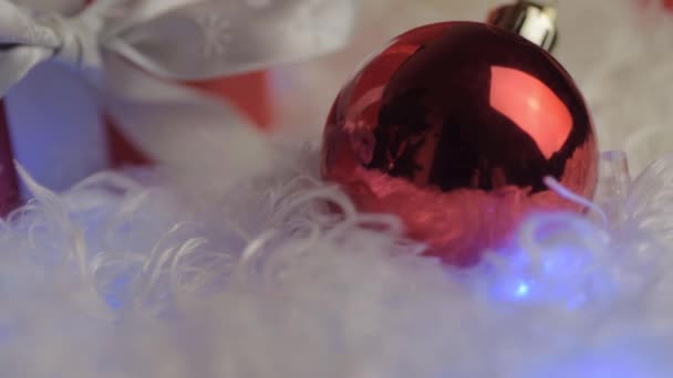 Christmas Red Bauble Gift White Fur Fairy Lights Background — Stock video