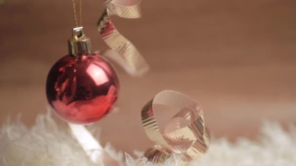 Christmas Red Bauble Swinging White Gold Ribbon Background — Stockvideo