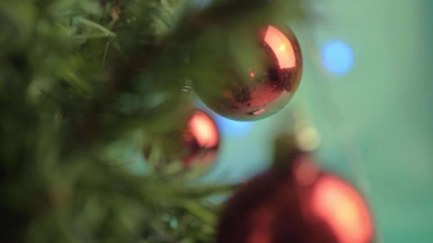 Christmas Red Baubles Flashing Lights Bokeh Green Background — Video