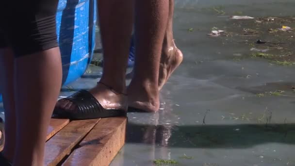 Close Migrants Feet Wet While Washing Clothes — Stok Video