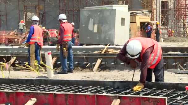 Medium Shot Workers Busy Middle Big Construction — Vídeos de Stock