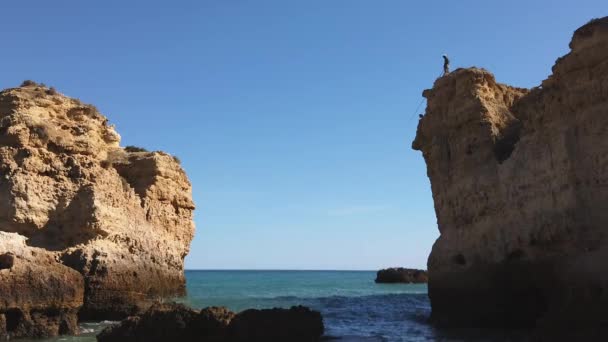 Lone Fisherman Casts Line Perch Atop Algarve Cliff Portugal Wide — Vídeo de Stock