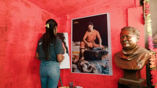 Low Angle Static Shot Showing Asian Teen Artist Painting Incredible — 비디오