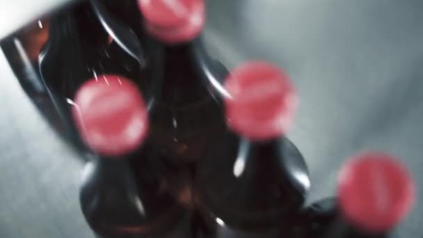 Top View Red Capped Bottles Being Rotated Manufacturing Process Factory — Stockvideo