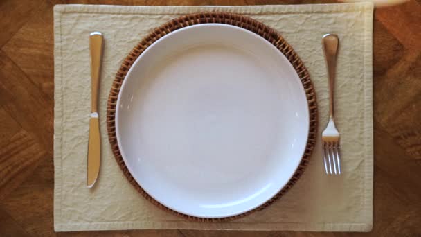 Caucasian Hand Serves Whole Living Plant Plate Dinner Setting Close — Video Stock