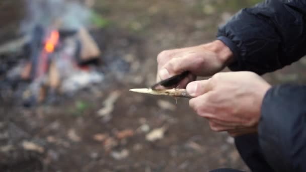 Caucasian Male Carves Spear Knife Camping Setting Hands Only Close — 图库视频影像