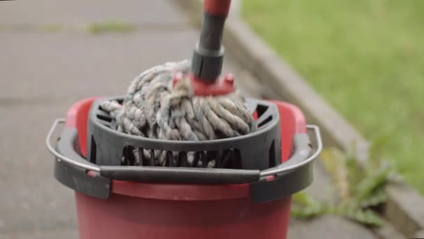 Wringing Cleaning Mop Red Bucket Wide Shot — Stockvideo