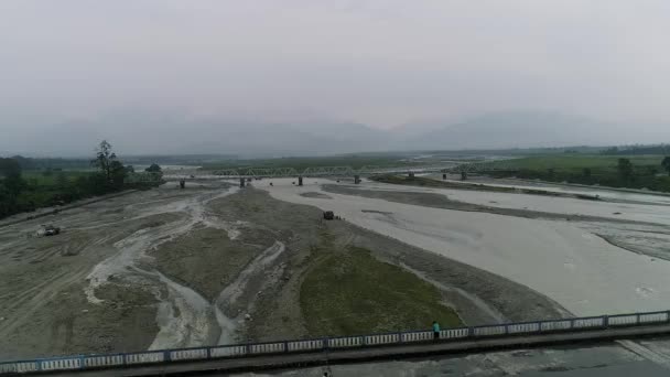 Aerial View Bridge Riverbed Swollen Rushing Water Rainy Season Misty — Stockvideo