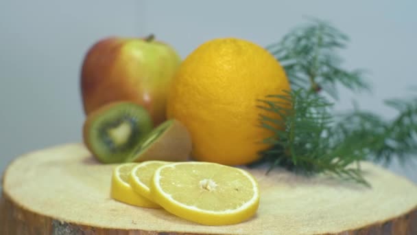 Close Video Camera Zooming Fruits Orange Apple Kiwi Lemon Wooden — Stockvideo