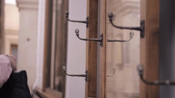 Woman Hanging Coat Vintage Ornate Coat Hanger Hooks — Stock Video