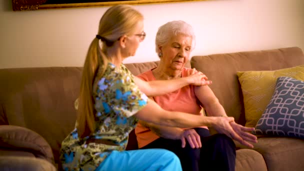 Home Healthcare Therapist Helping Elderly Woman Arm Stretches — Wideo stockowe