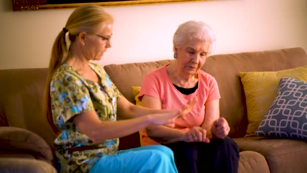 Home Healthcare Therapist Helping Elderly Woman Arm Stretches — Vídeos de Stock