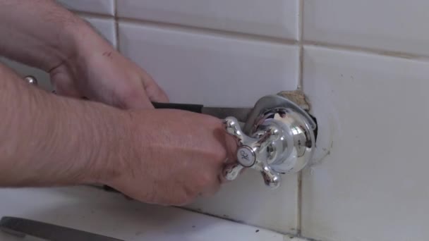 Steady Shot Man Making Sure Tap Secured Wall — Video