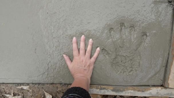 Overhead Slow Motion Shot Woman Pressing Her Hand Concrete Sidewalk — Video