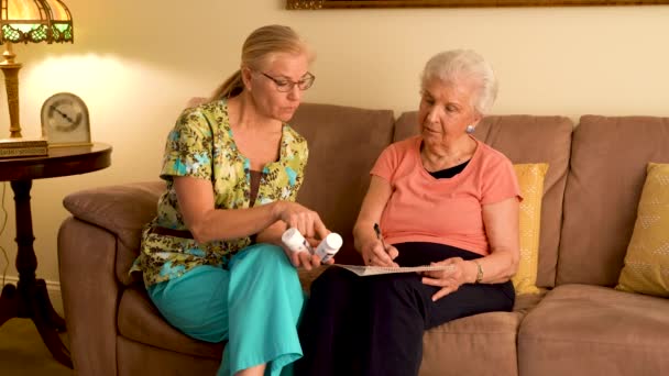 Home Healthcare Nurse Going Medications Elderly Woman While Sitting Living — Wideo stockowe