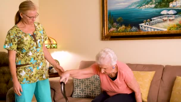 Closeup Home Healthcare Nurse Helps Elderly Woman Get Couch Use — Video Stock