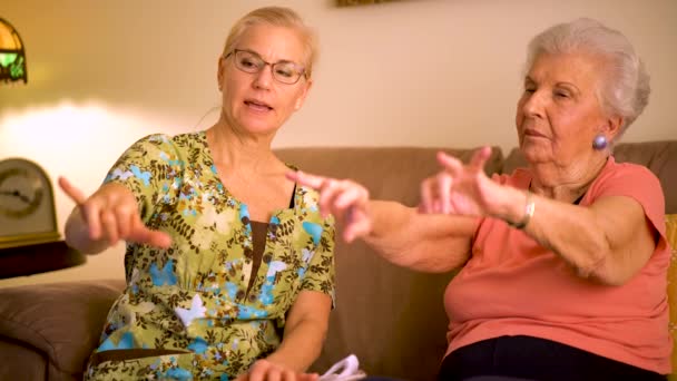 Closeup Home Healthcare Nurse Helping Elderly Woman Hand Wrist Range — Wideo stockowe