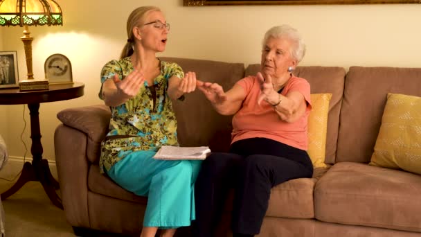 Home Healthcare Nurse Helping Elderly Woman Hand Wrist Range Motion — Vídeos de Stock