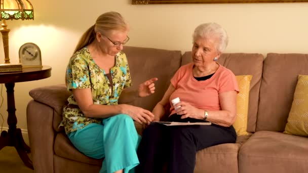 Elderly Woman Tries Take Lids Medication Bottles — 图库视频影像