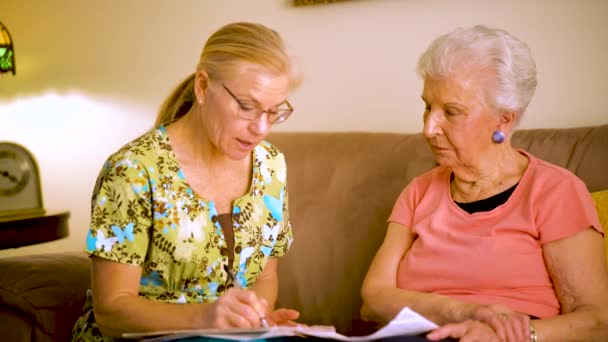 Closeup Elderly Woman Home Healthcare Nurse Going Paperwork — Wideo stockowe