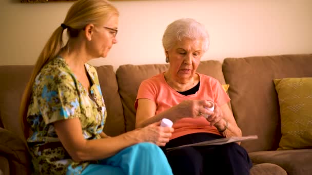 Closeup Home Healthcare Nurse Going Medications Elderly Woman While Sitting — Vídeo de Stock