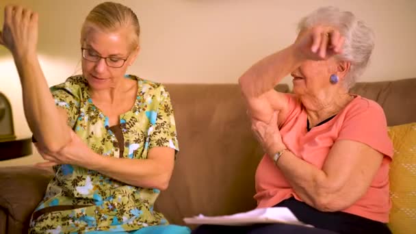 Home Healthcare Nurse Helping Elderly Woman Arm Range Motion Stretches — 图库视频影像