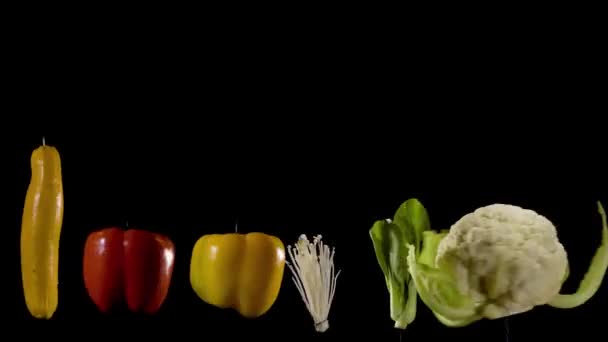 Array Colorful Organic Vegetables Spin Fast Motion Black Background Part — Stockvideo