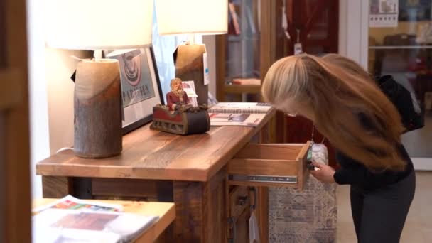 Pretty Mature Blonde Woman Looking Sideboard Its Drawers Furniture Showroom — Stock Video
