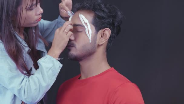 Professional Make Artist Putting White Prosthetic Insert Man Face Make — Stockvideo